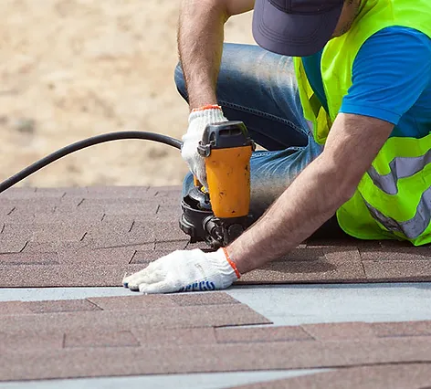 Contractor installing shingle roofing to home in jacksonville florida