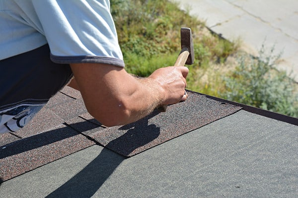 Installing new Asphalt shingles, emergency repair, Aj wells roofing and COnstruction